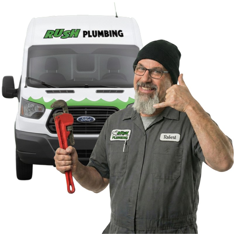 Robert Craul from Rush Plumbing standing in front of a Rush Plumbing truck, holding a pipe wrench ready to help with your frozen pipes